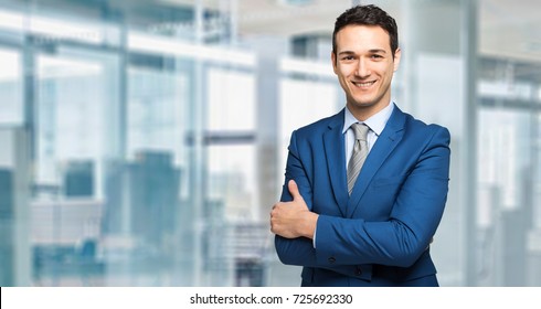 young-manager-smiling-modern-office-260nw-725692330